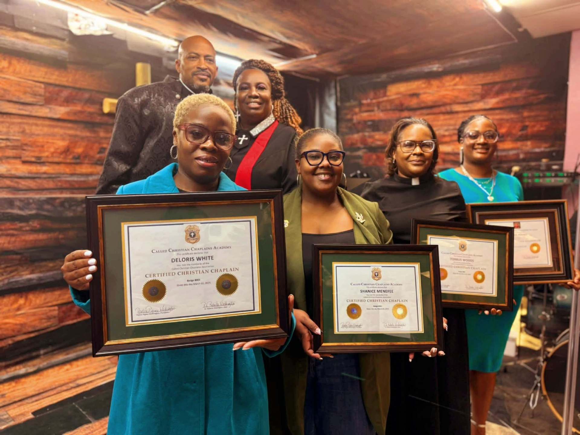 Certified Christian Chaplains with framed certificates