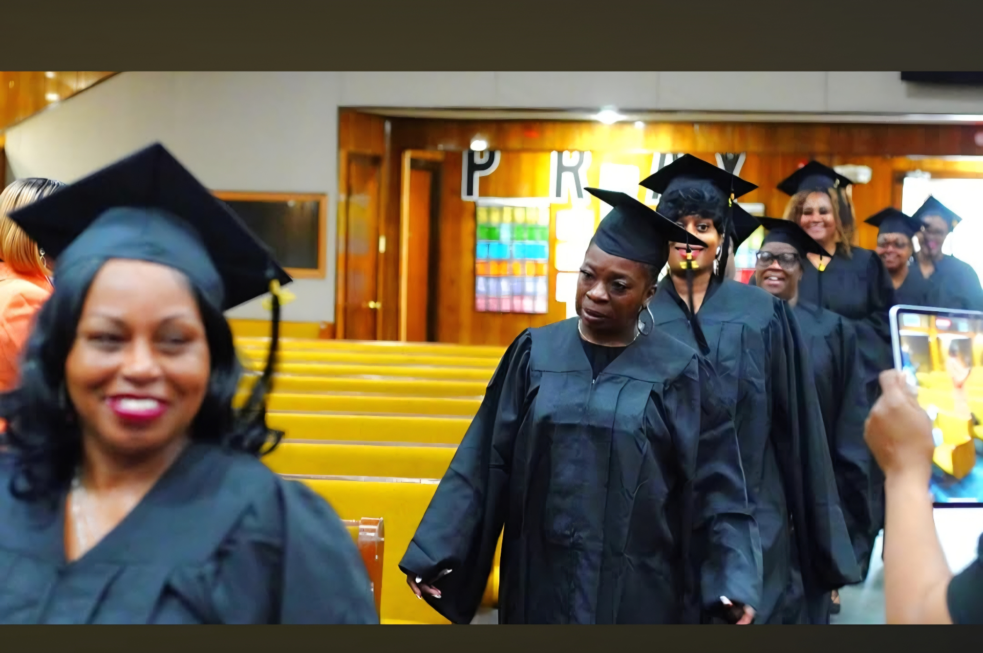 CALA graduates processing in caps and gowns